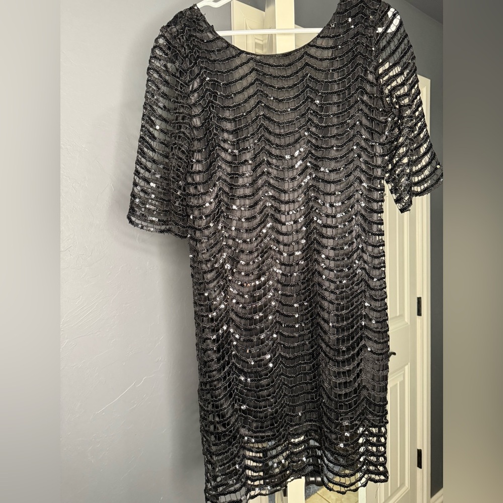Black sequin mini t-shirt dress. Size Medium.